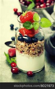 Yogurt with baked granola and berries - Healthy Breakfast concept