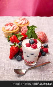 Yogurt with berries and cupcake