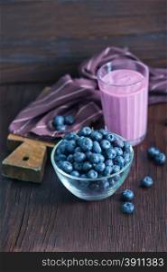 yogurt with blueberry on the wooden table