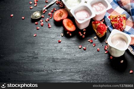 Yogurt with fresh fruit. On the black chalkboard.. Yogurt with fresh fruit.