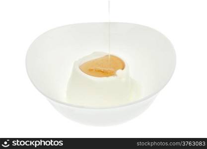 Yogurt with honey in bowl isolated on white background