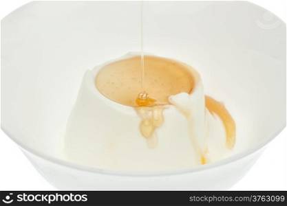 Yogurt with honey on top in bowl