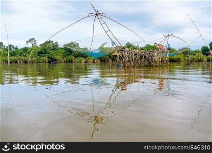 Yok Yor, is a fishing with local wisdom. Tool for capture aquatic animals of native people made of bamboo and net are trap rural lifestyle at Pakpra canal, Baan Pak Pra, Phatthalung, Thailand. Yok Yor, is a fishing with local wisdom in Thailand