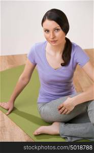 Yong woman doing exercise yoga pose at home or gym