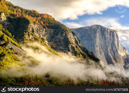 Yosemite National Park Valley at cloudy autumn morning from Tunnel View. Low clouds lay in the valley. California, USA.