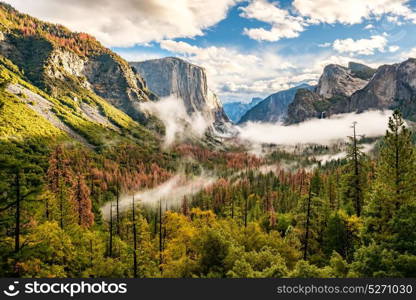 Yosemite National Park Valley at cloudy autumn morning from Tunnel View. Low clouds lay in the valley. California, USA.