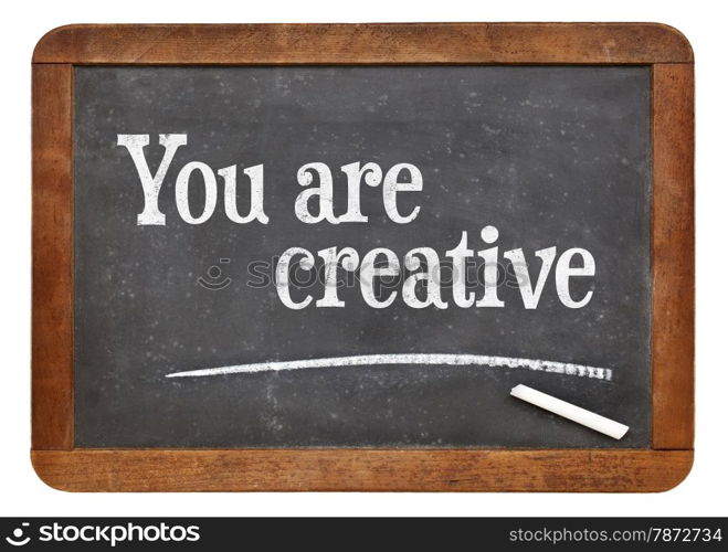 You are creative - positive affirmation words on a vintage slate blackboard