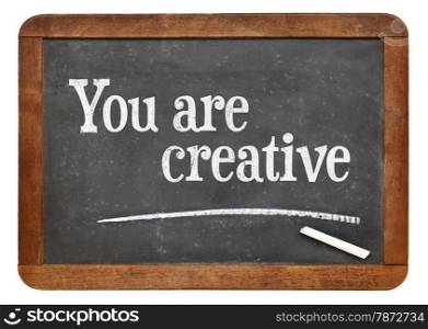 You are creative - positive affirmation words on a vintage slate blackboard
