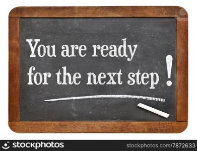 You are for the next step - motivational statement on a vintage slate blackboard