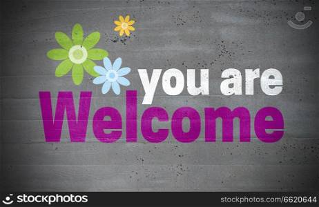 You are welcome on concrete wall background.. You are welcome on concrete wall background
