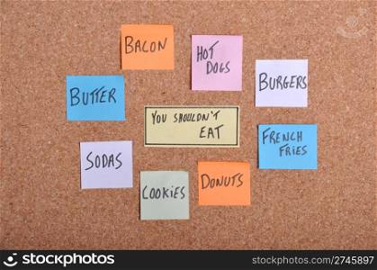 you should not eat concept with colorful paper notes on a bulletin board
