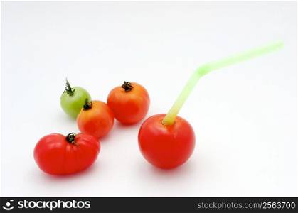 You thought you got a fresh tomato juice before? Can&acute;t beat this one. Small tomatoes in a glass filled with water and with a sugar coating with a straw.