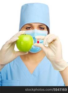 Yougn doctor with pill and apple isolated
