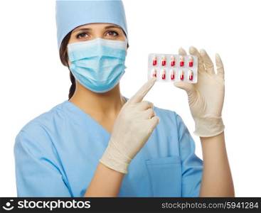 Yougn doctor with pills isolated