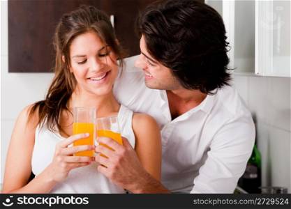 youn couple cheersing their drink