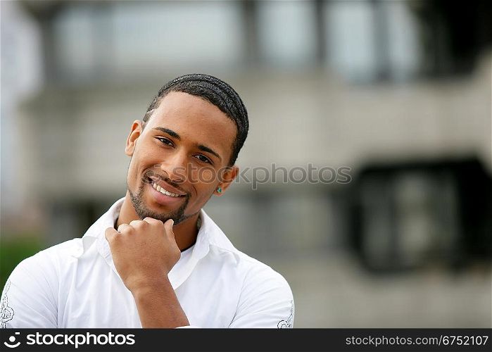 Younf african man posing outside