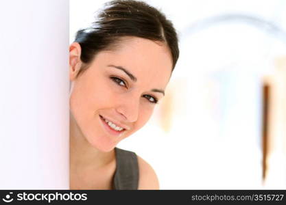 Young active businesswoman standing in hall