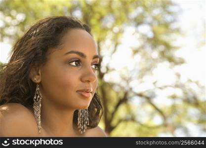 Young-adult African American woman looking to the side.