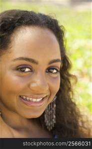 Young-adult African American woman making eye contact.