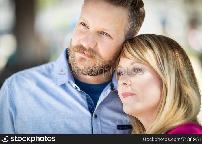 Young Adult Caucasian Couple Portrait At The Park.