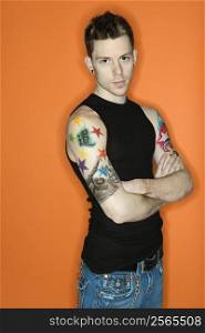 Young adult Caucasian male with tattoos.