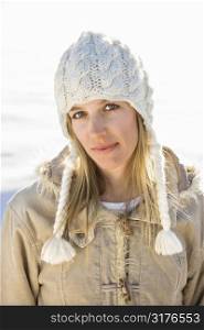 Young adult Caucasian woman in winter attire looking at viewer.