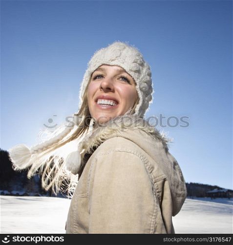 Young adult Caucasian woman outdoors in winter attire.