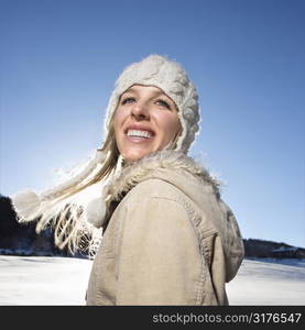 Young adult Caucasian woman outdoors in winter attire.