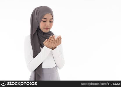 Young Adult Muslim Woman girl making Duas for Muslim god blessing prayer. Studio shot of woman isolated on white background