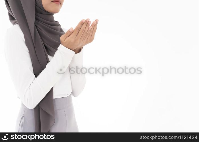Young Adult Muslim Woman girl making Duas for Muslim god blessing prayer. Studio shot of woman isolated on white background