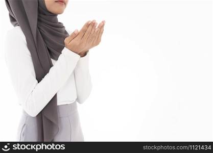 Young Adult Muslim Woman girl making Duas for Muslim god blessing prayer. Studio shot of woman isolated on white background