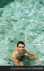 young adult smiling on translucid water in a Maldivian Island