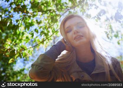 Young adult woman spending quality time in the forest