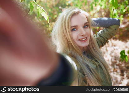 Young adult woman spending quality time in the forest