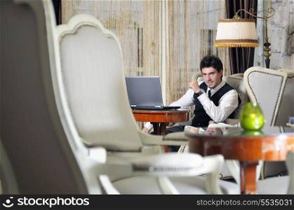 young adult working on laptop