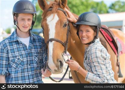 young adults with a horse