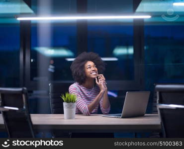 Young african american female Entrepreneur Freelancer Working Using A Laptop In Coworking space