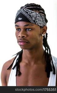 Young African-American man in black urban do-rag looking away isolated on white.. Young black man in do-rag looking away