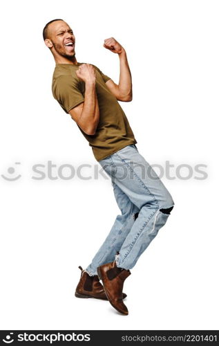 Young African-American man yes win gesturing over white background.. Young African-American man yes win gesturing over white background