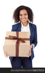 Young African American woman holding a present on white background