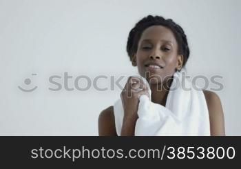 Young african american woman in sportswear looking at camera in gym