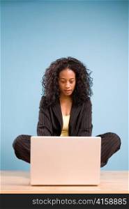 Young African American Woman Working on Laptop