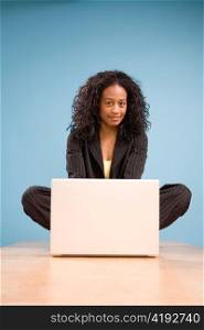 Young African American Woman Working on Laptop