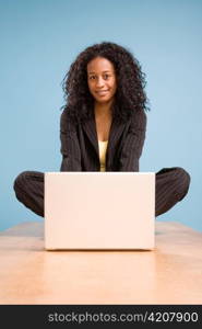 Young African American Woman Working on Laptop