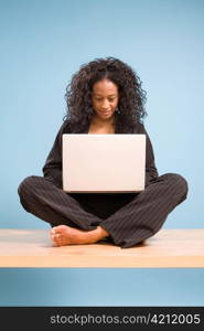 Young African American Woman Working on Laptop