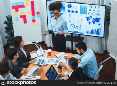 Young african businesswoman presenting data analysis dashboard on TV screen in modern meeting. Business presentation with group of business people in conference room. Concord. Young african businesswoman presenting data analysis dashboard on TV. Concord