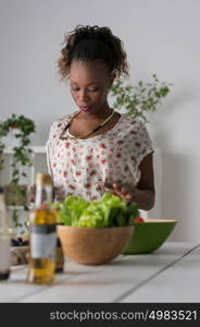 Young African Woman Cooking. Healthy Food - Vegetable Salad. Diet. Dieting Concept. Healthy Lifestyle. Cooking At Home. Prepare Food