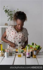 Young African Woman Cooking. Healthy Food - Vegetable Salad. Diet. Dieting Concept. Healthy Lifestyle. Cooking At Home. Prepare Food