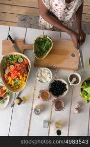 Young African Woman Cooking. Healthy Food - Vegetable Salad. Diet. Dieting Concept. Healthy Lifestyle. Cooking At Home. Prepare Food. Top View