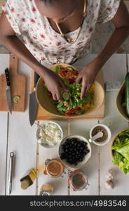 Young African Woman Cooking. Healthy Food - Vegetable Salad. Diet. Dieting Concept. Healthy Lifestyle. Cooking At Home. Prepare Food. Top View